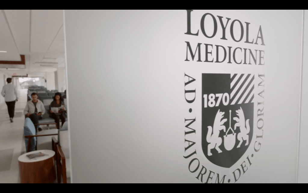 Loyola Medicine logo on a frosted window